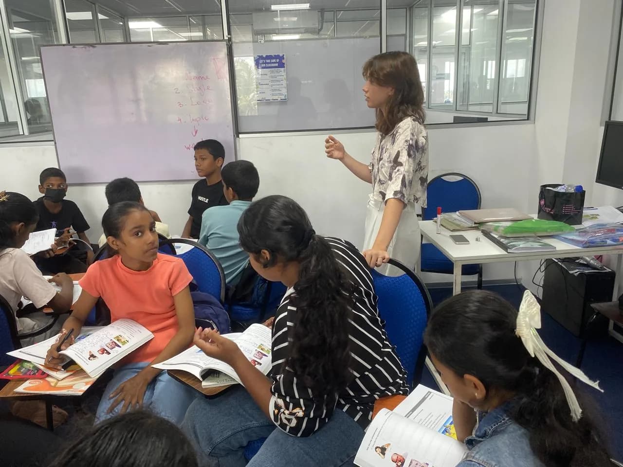 Student Development learners taking part in a group classroom discussion